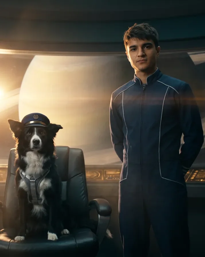 Alex and Ace, his border collie in a captain's cap, on the bridge of a starship